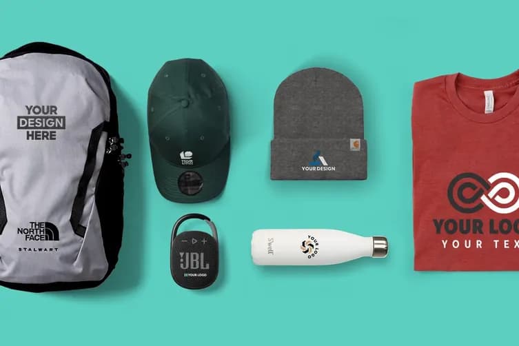 Assorted custom branded merchandise including backpack, hat, beanie, water bottle, speaker, and t-shirt featuring company logos.