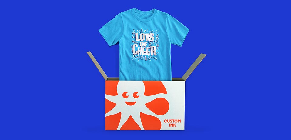 A custom t-shirt and the Custom Ink shipping box