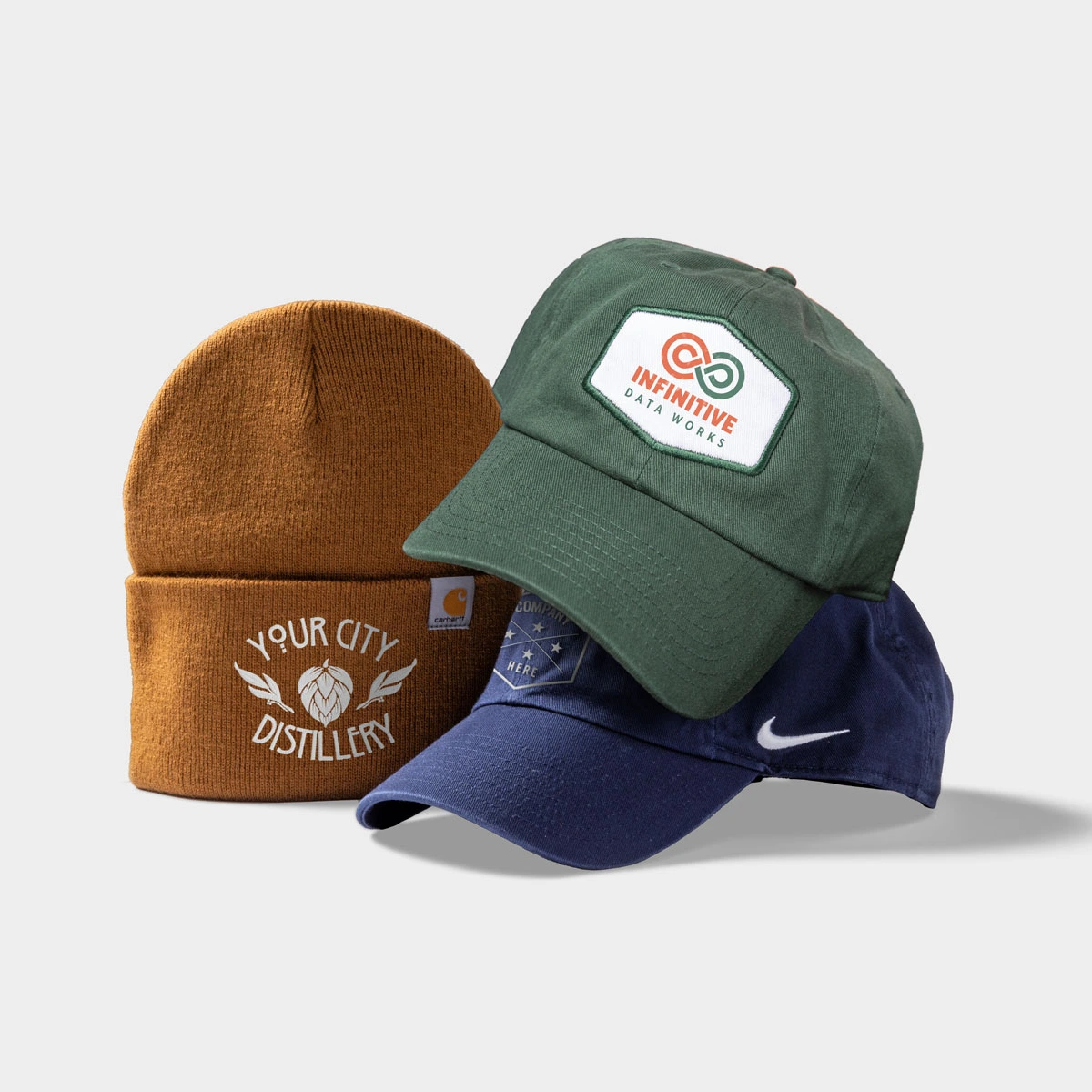 Two baseball hats and a Carhartt beanie