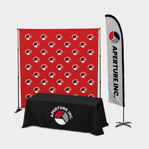 A table cloth, step and repeat banner, and feather flag are arranged together
